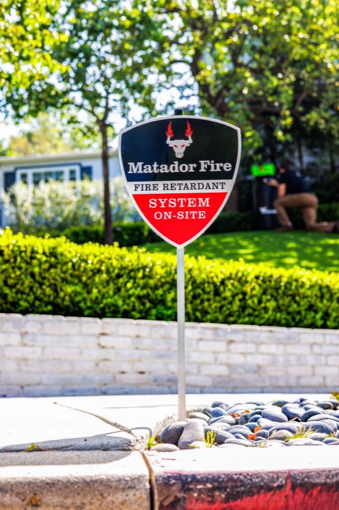 Matador Fire wildfire defense system on-site sign at a home
